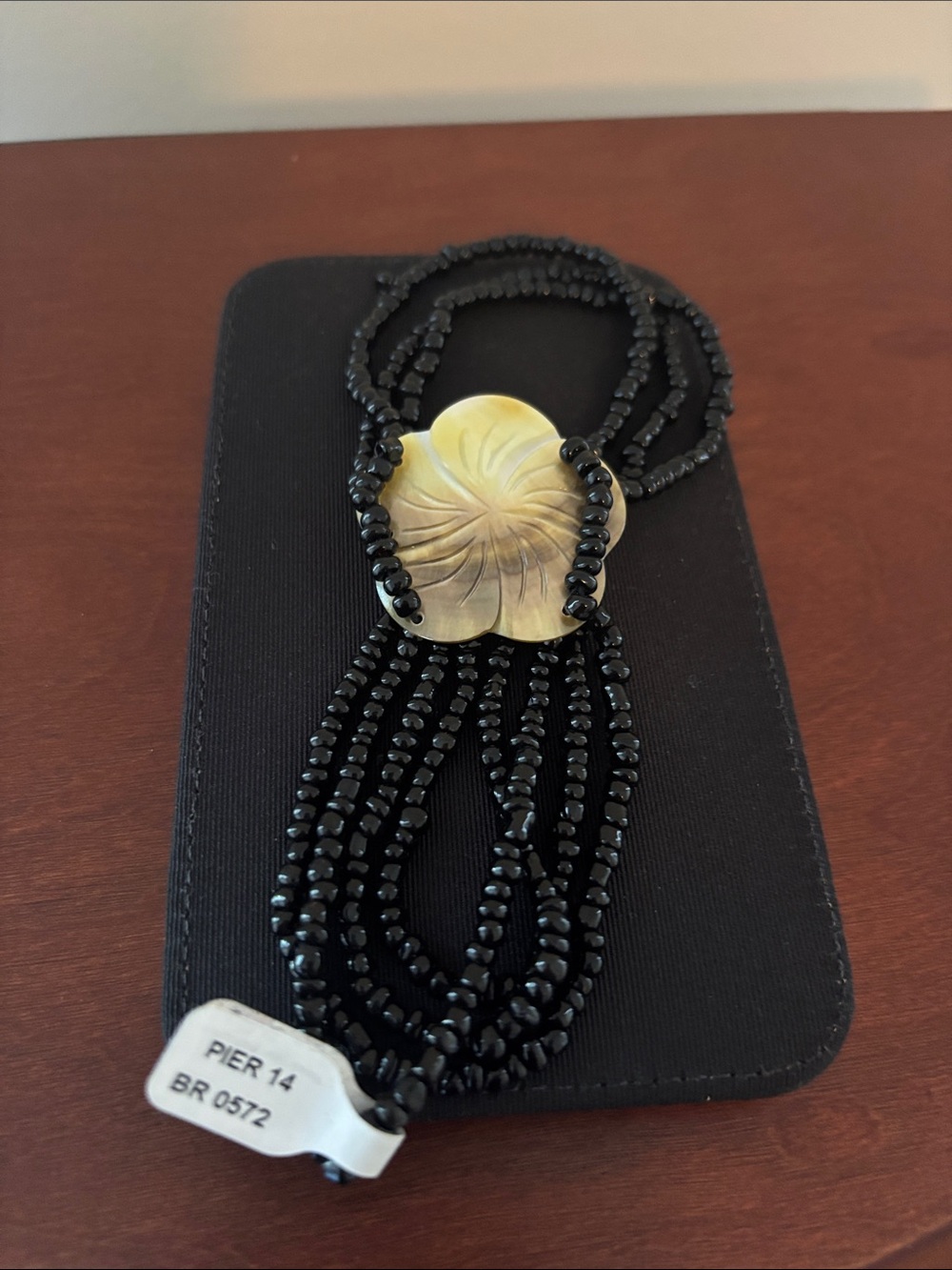 Pier 14 Black Beaded Multi-Strand Necklace with Gold Floral Shell Medallion
